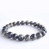 Black rutilated quartz crystal bracelet. Genuine natural and unheated gemstone with Certificate of Authenticity
