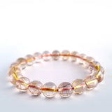 Red copper rutilated quartz crystal bracelet. Genuine natural and unheated gemstone with Certificate of Authenticity