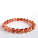 Red copper rutilated quartz crystal bracelet. Genuine natural and unheated gemstone with Certificate of Authenticity