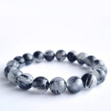 Black rutilated quartz crystal bracelet. Genuine natural and unheated gemstone with Certificate of Authenticity