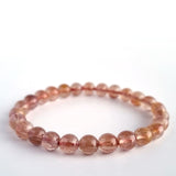 Red copper rutilated quartz crystal bracelet. Genuine natural and unheated gemstone with Certificate of Authenticity
