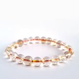 Red copper rutilated quartz crystal bracelet. Genuine natural and unheated gemstone with Certificate of Authenticity