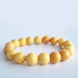 Burmese Yellow Jade 11mm round-bead bracelet. Genuine unheated gemstone with Certificate of Authenticity